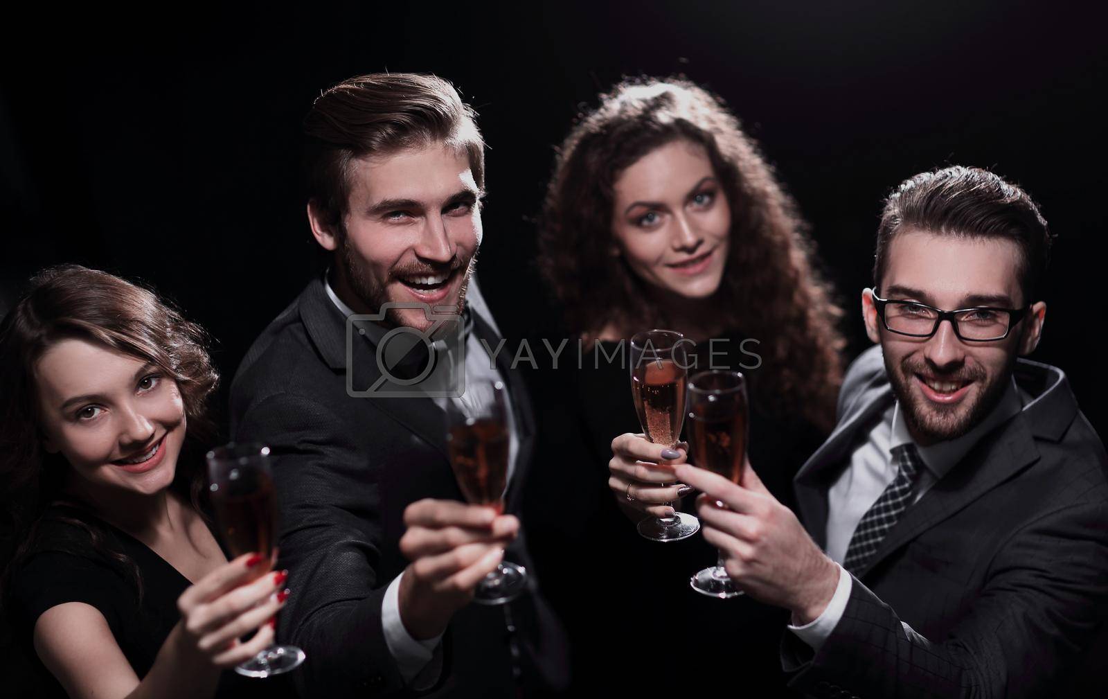 happy young people with a glass of wine.isolated on a black background.
