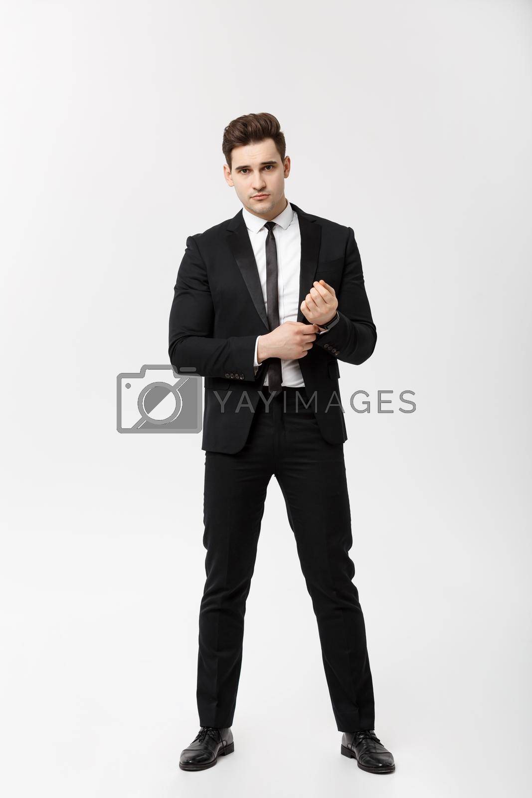 Royalty free image of Full length Portrait Businessman posing stylishly on white background. by Benzoix