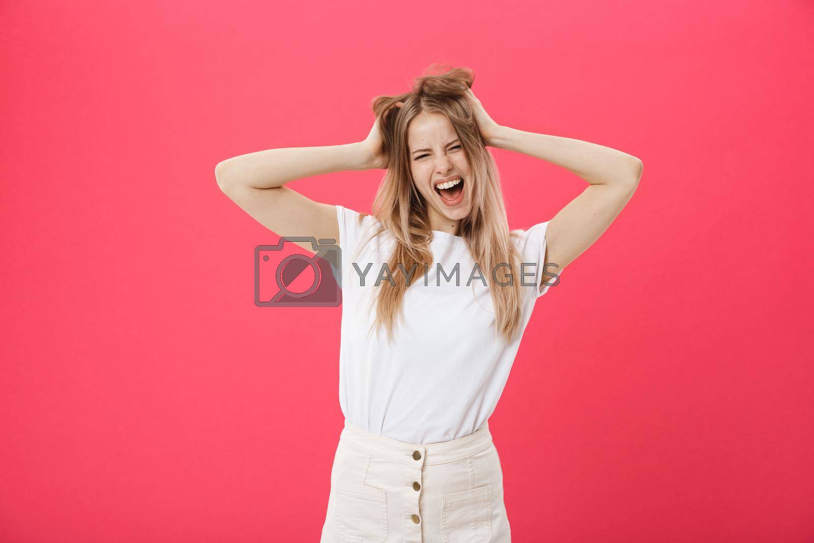 Royalty free image of Young woman getting angry ,crazy and shouting isolated on a pink background. by Benzoix
