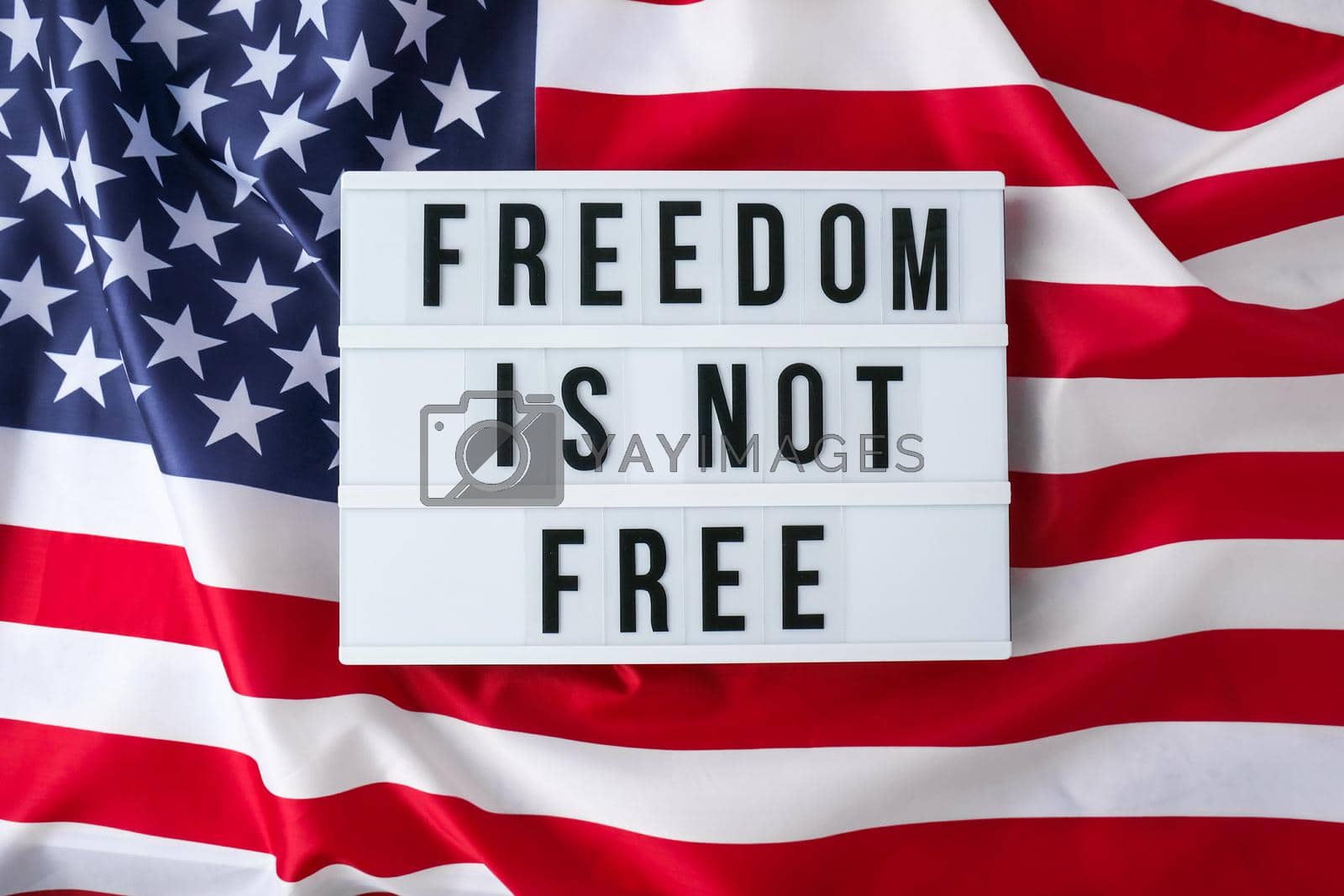 Royalty free image of American flag. Lightbox with text FREEDOM IS NOT FREE Flag of the united states of America. July 4th Independence Day. USA patriotism national holiday. Usa proud. by anna_stasiia