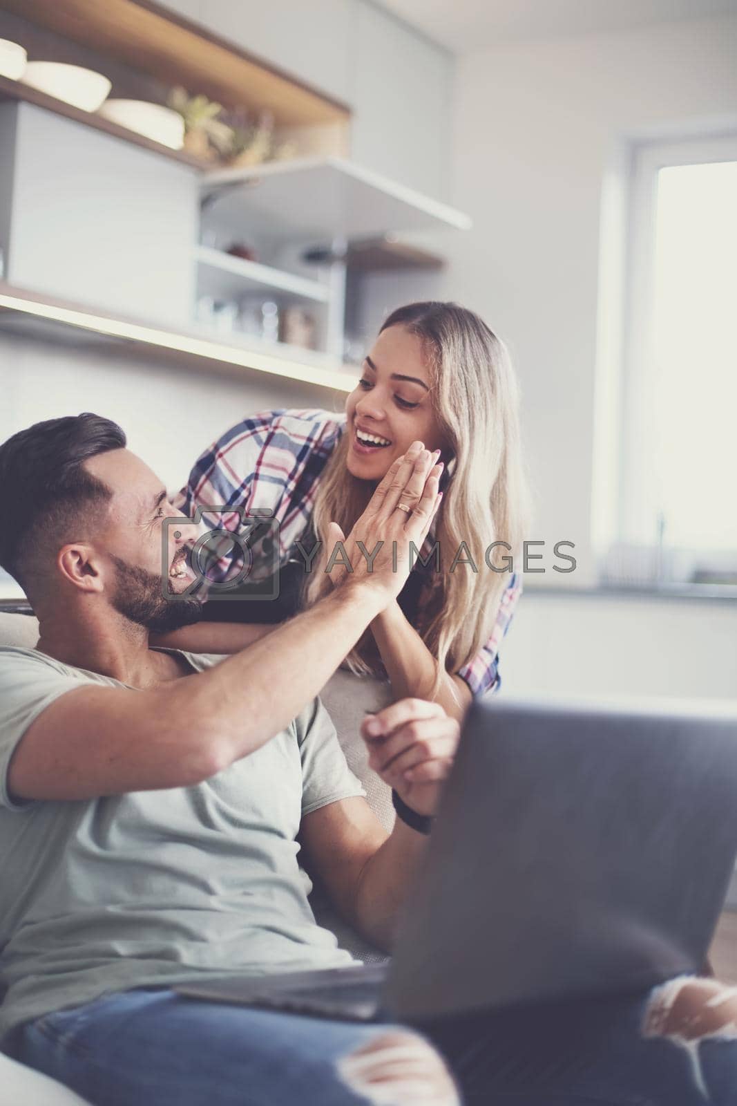 Royalty free image of happy couple giving each other a high five by asdf