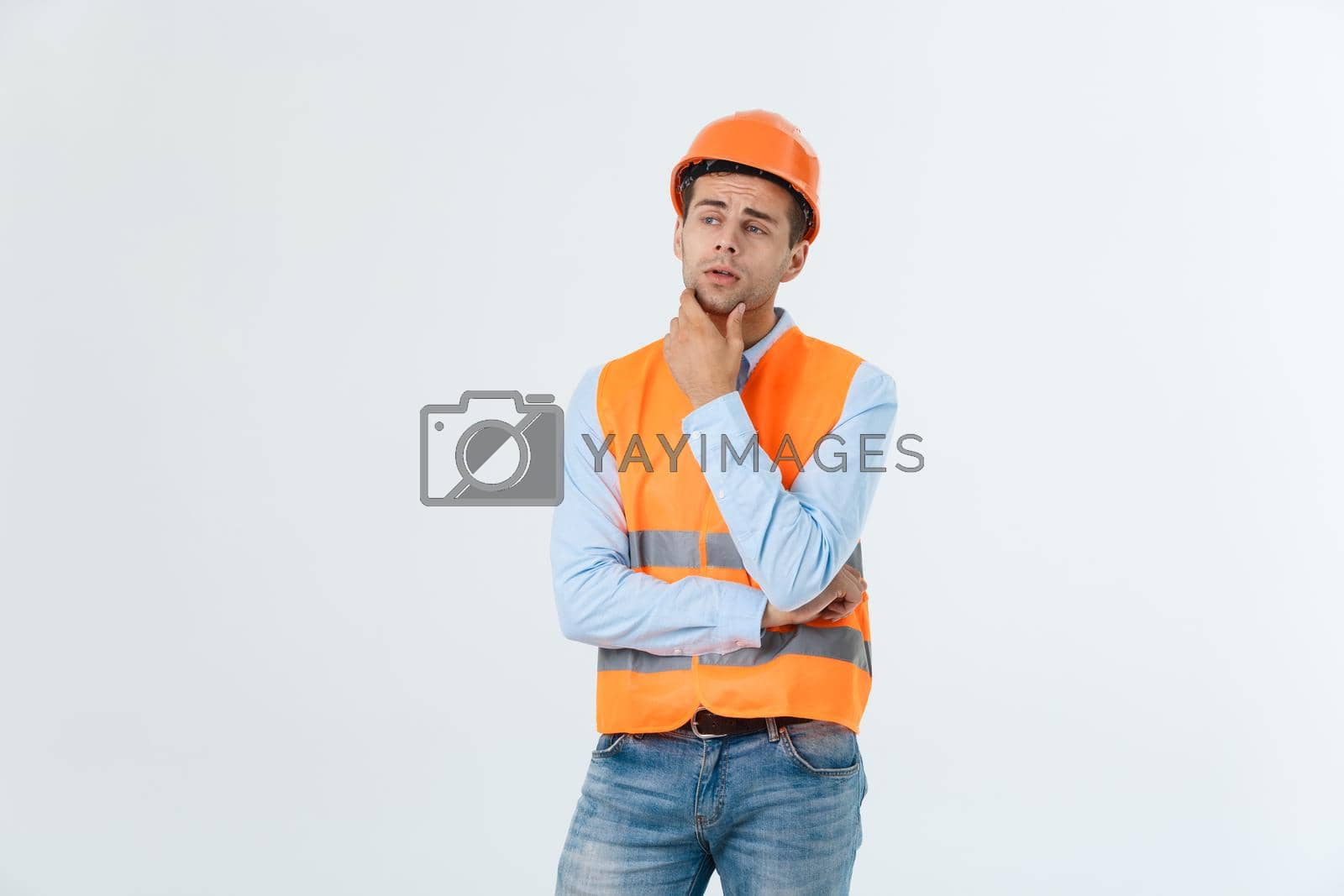 Royalty free image of Thoughtful architect or engineer serious thinking against grey background. by Benzoix