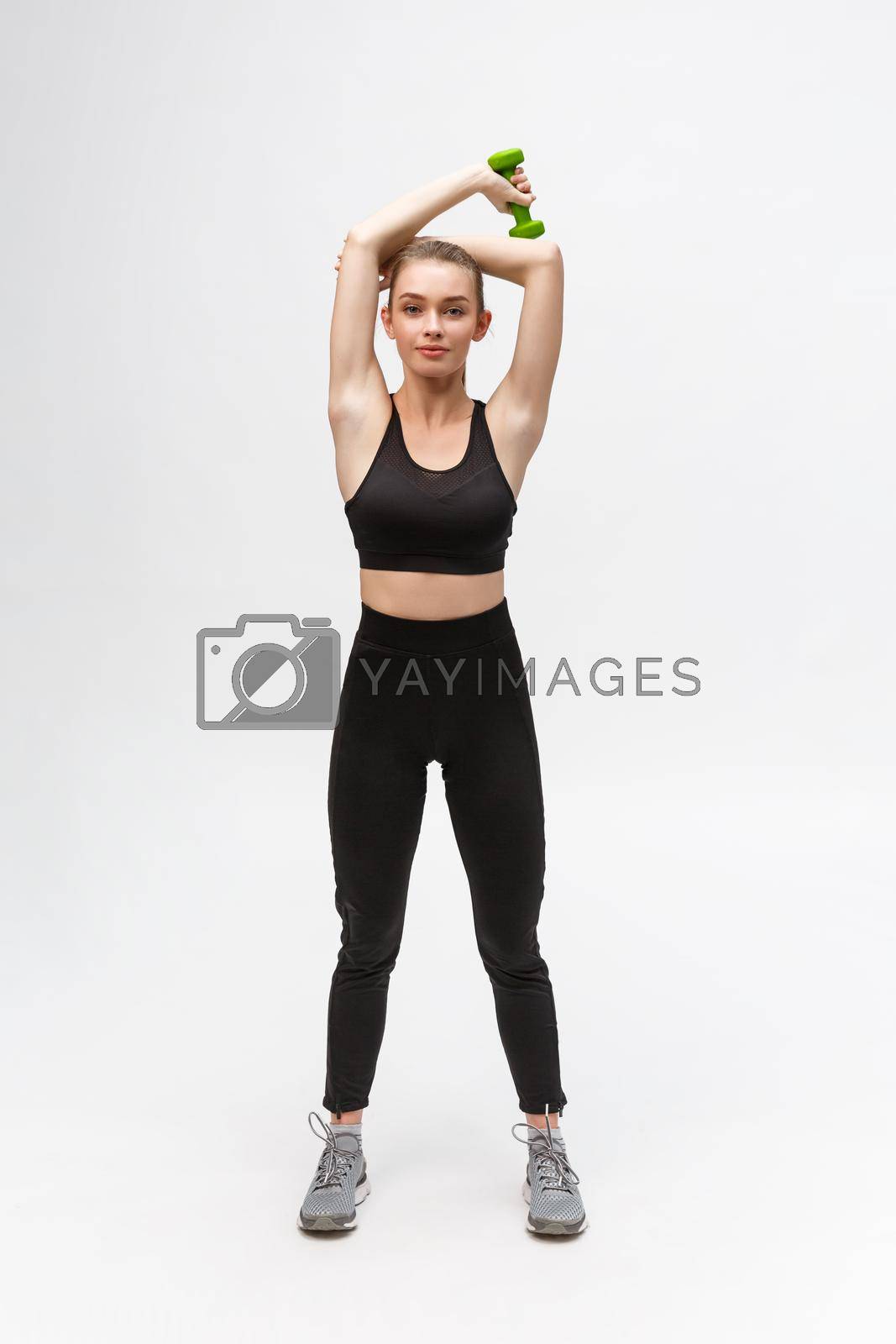 Young woman healthy lifestyle fitness with dumbbell