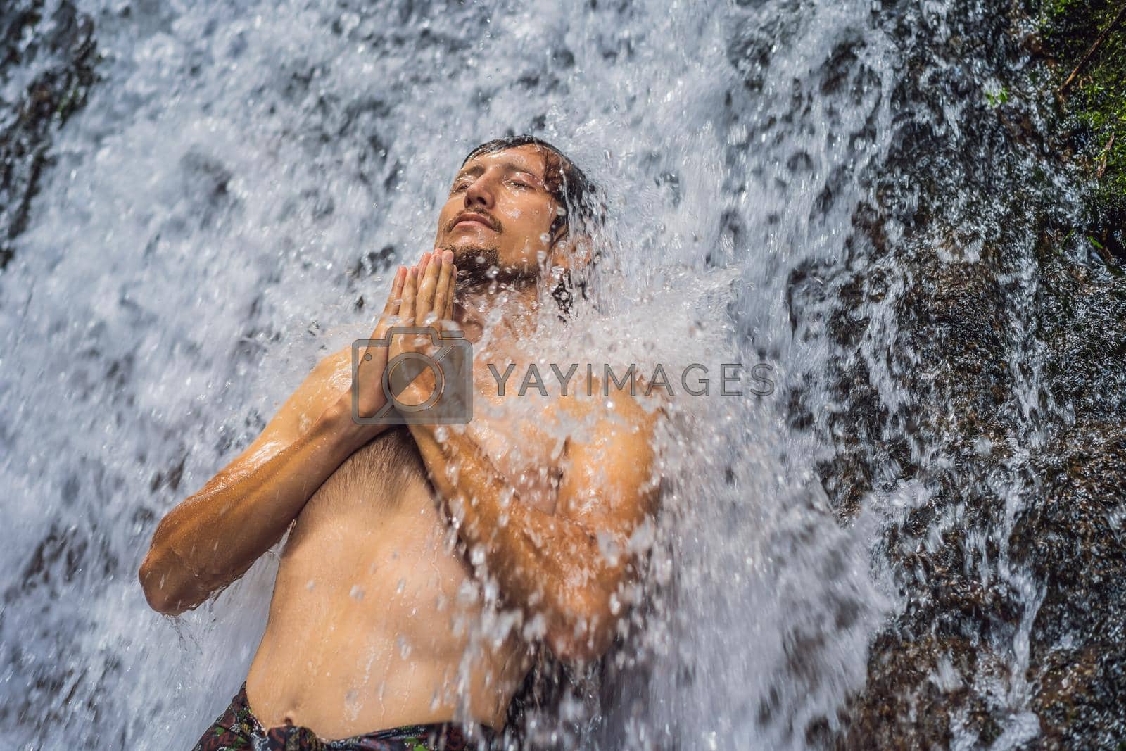 Royalty free image of Young man tourist in Holy springs Sebatu in Bali by galitskaya