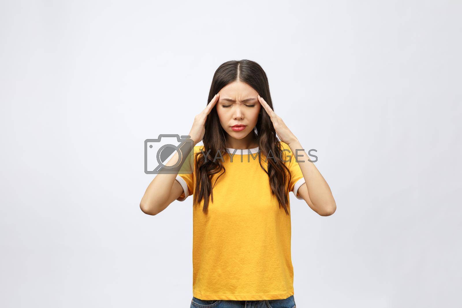 Royalty free image of Young Asian woman got sick and headache isolated on white background. by Benzoix