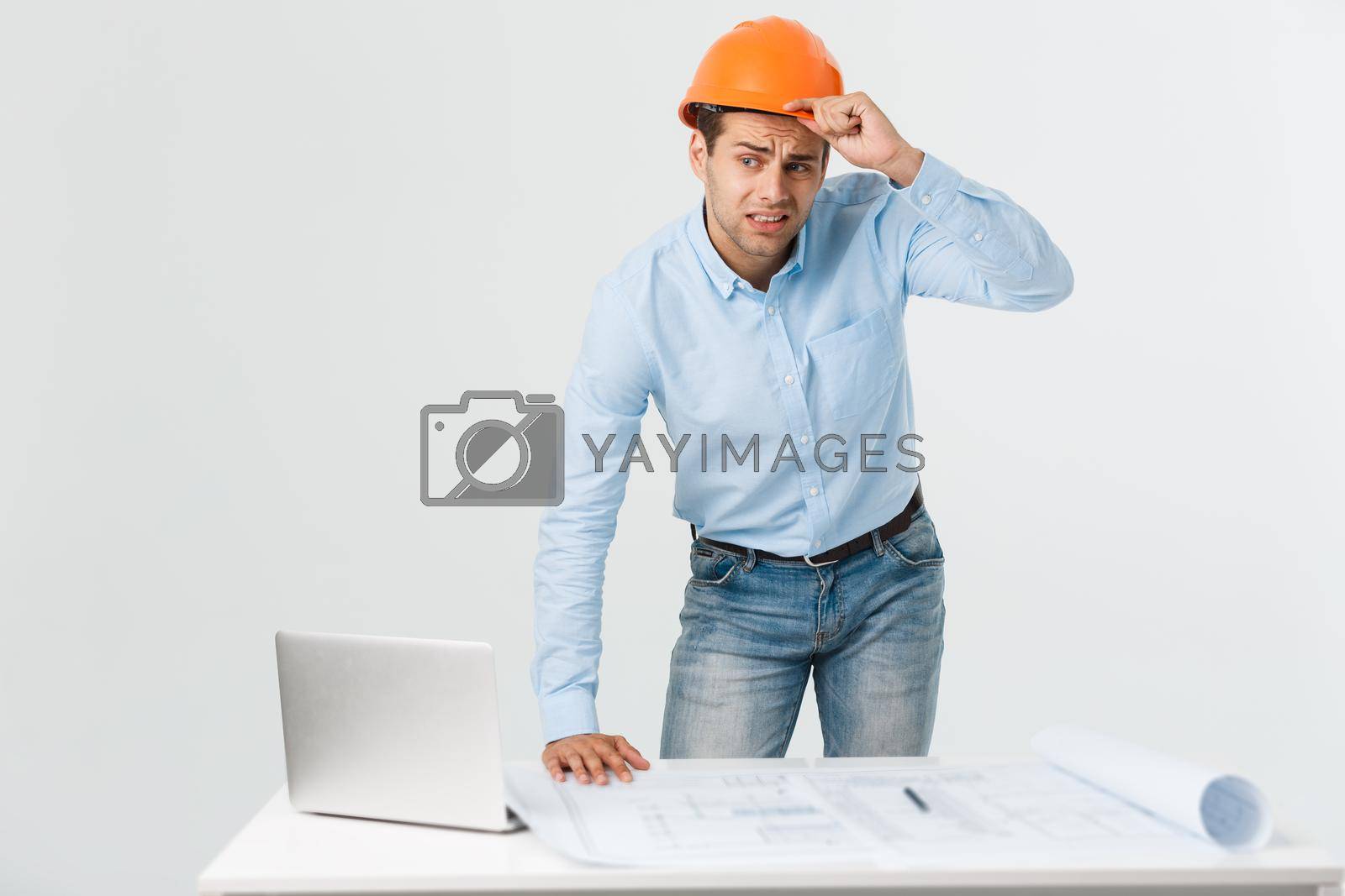 Royalty free image of Young workman annoyed angry in furious gesture. Negative expression on white grey background by Benzoix