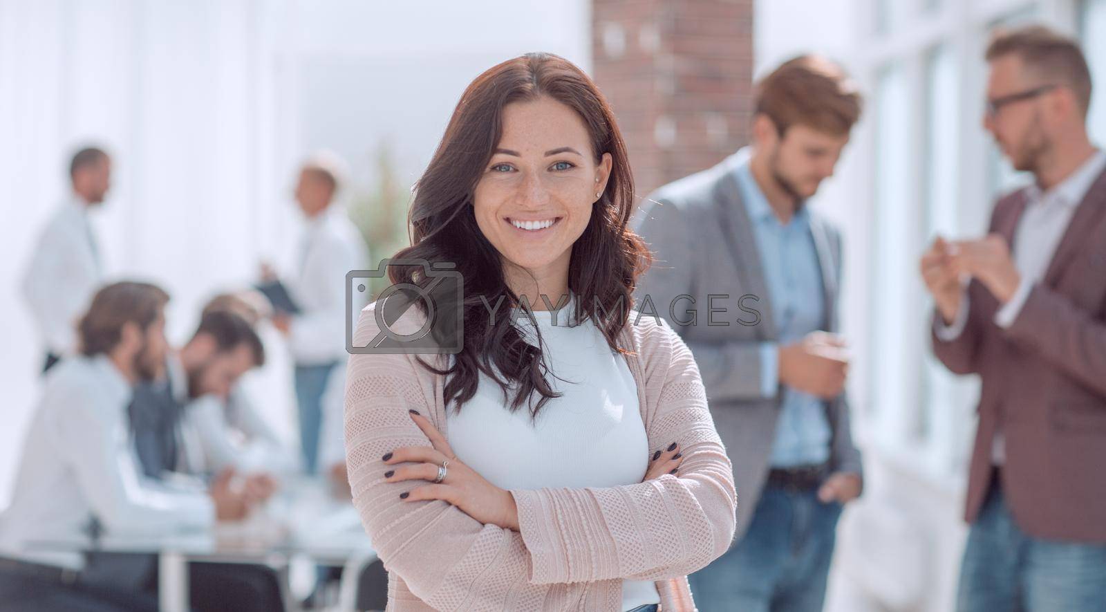 Royalty free image of Executive young woman standing in modern office. by asdf