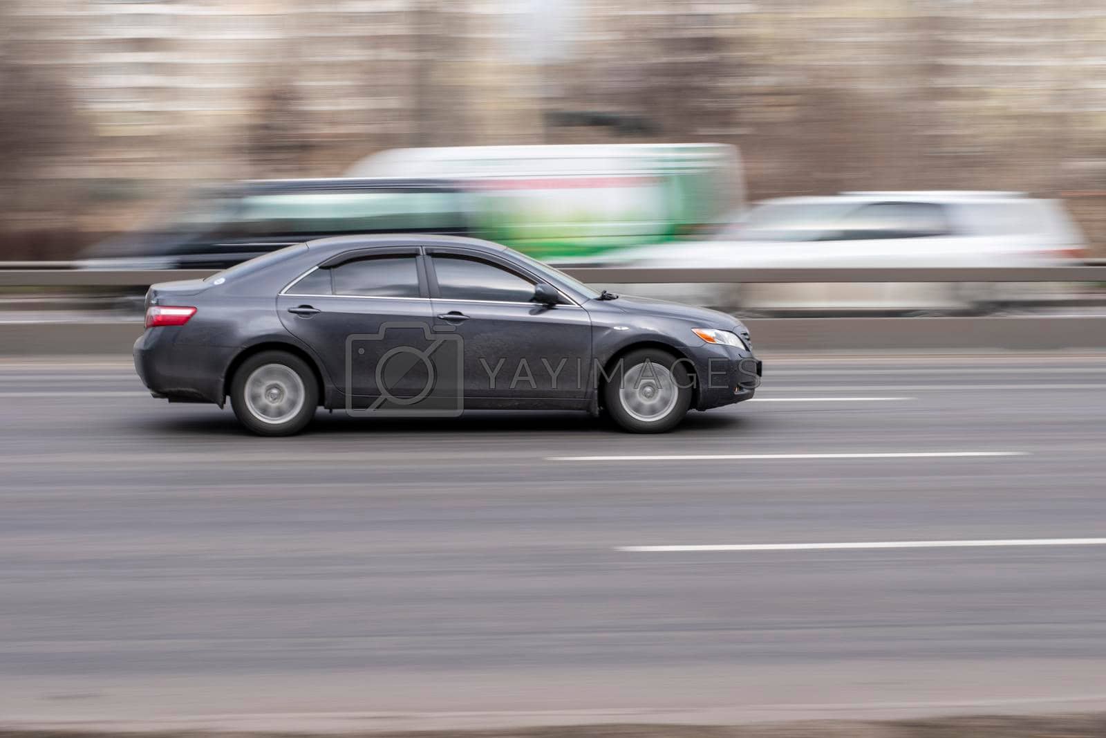 Royalty free image of Ukraine, Kyiv - 18 March 2021: Gray Toyota Camry car moving on the street. Editorial by Yuriy_Vlasenko