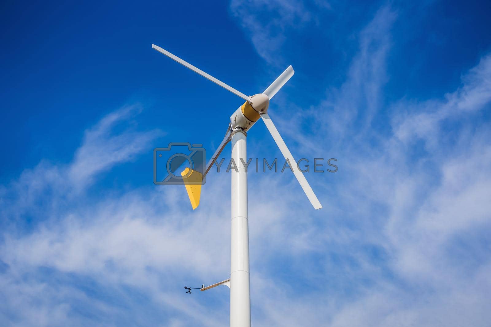 Royalty free image of Wind turbines generating electricity with blue sky - energy conservation concept by galitskaya
