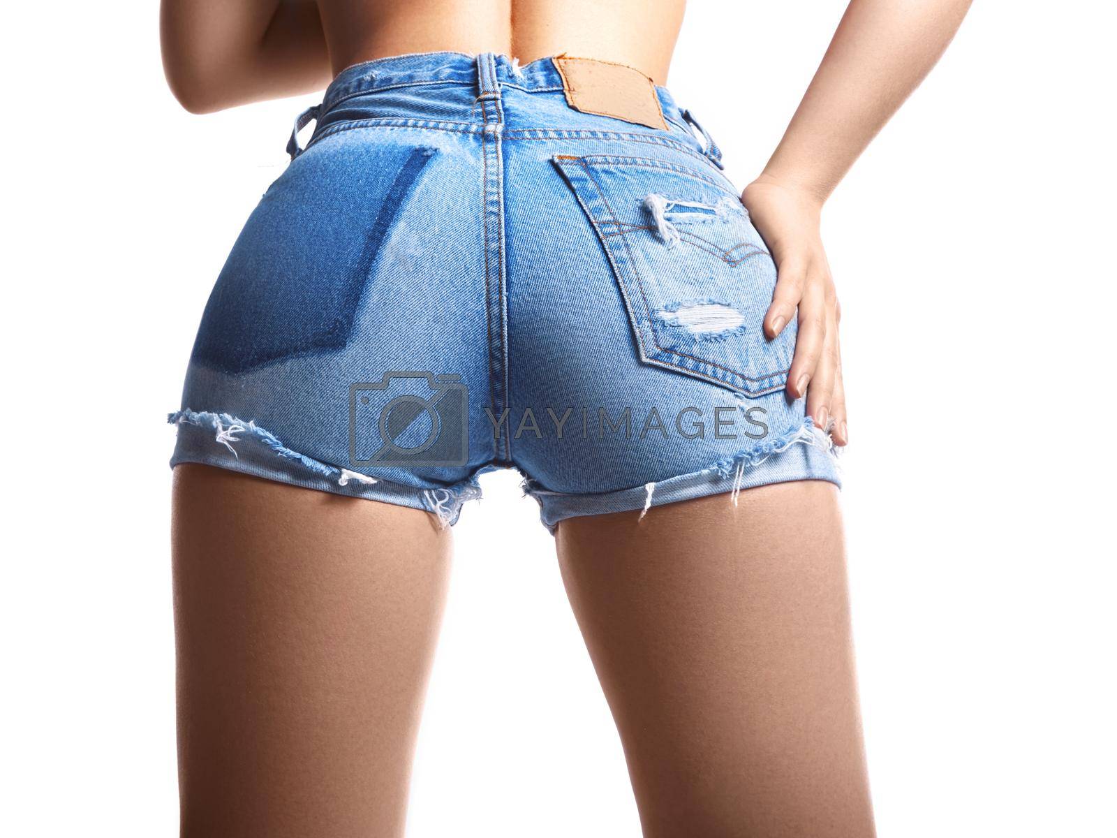 Sexy woman in fashion blue jeans shorts. Perfect hot booty and erotic curves hips. Good body shapes whithout cellulite. Sport and diet.