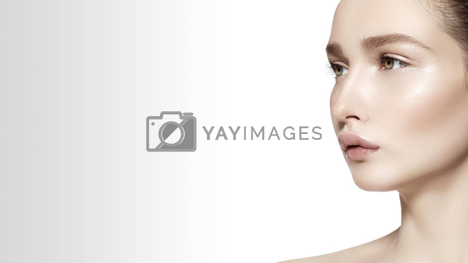 Royalty free image of Beautiful Face of young Woman. Skincare, Wellness, Spa. Clean soft Skin, healthy Fresh look. Natural daily makeup by MarinaFrost