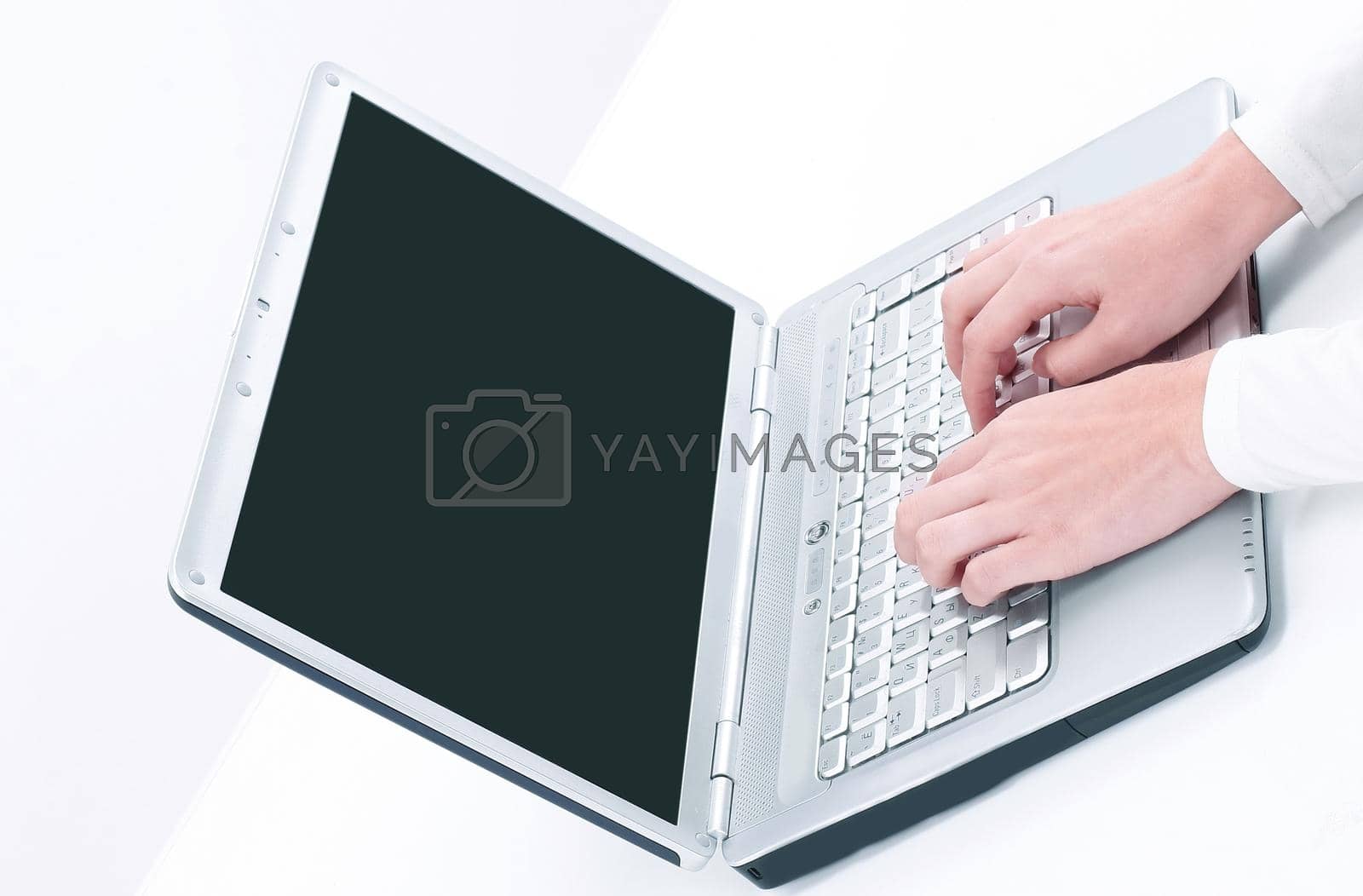 Royalty free image of closeup.business woman typing on a laptop by SmartPhotoLab