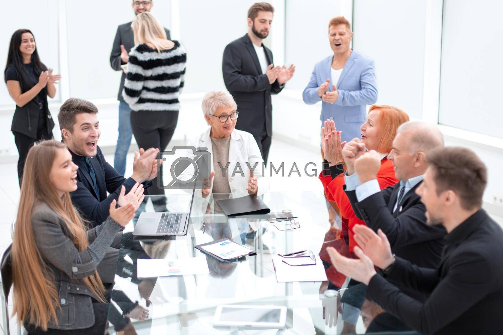 Royalty free image of Business people discussing project around glass table by asdf