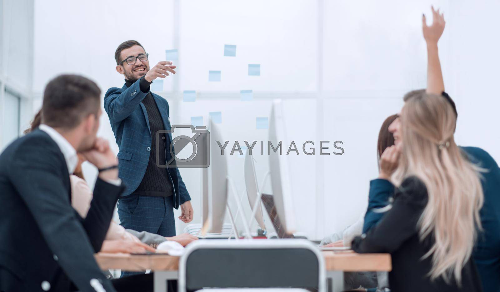 Royalty free image of project Manager asks questions during an office meeting. by asdf