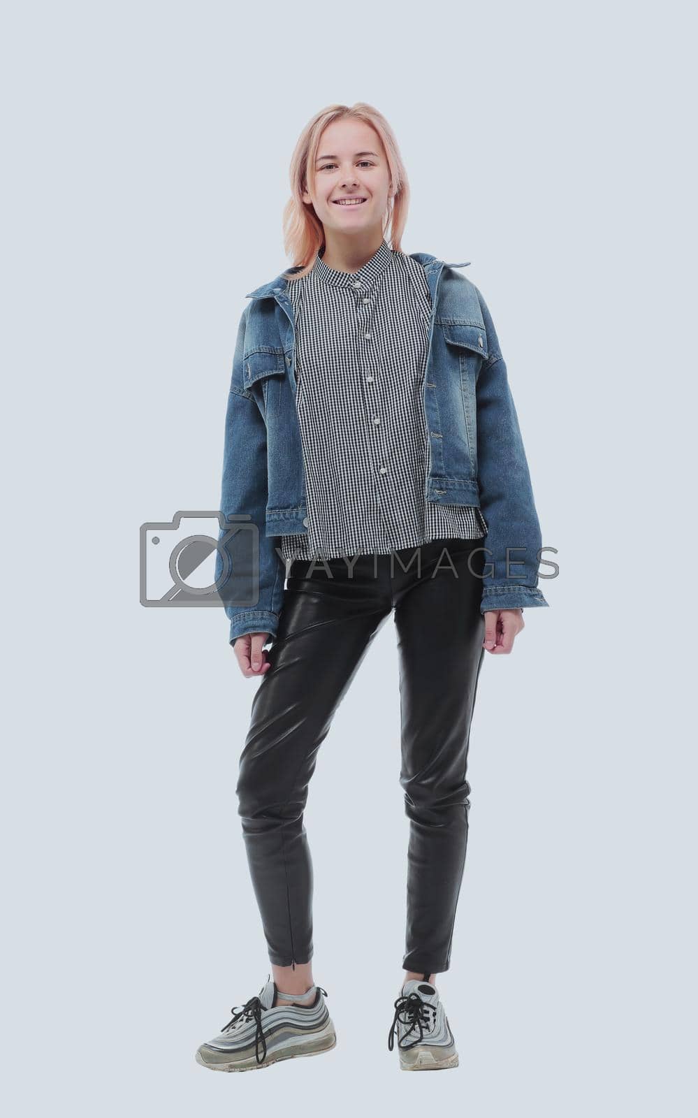 Royalty free image of in full growth. serious stylish girl in a denim jacket by asdf