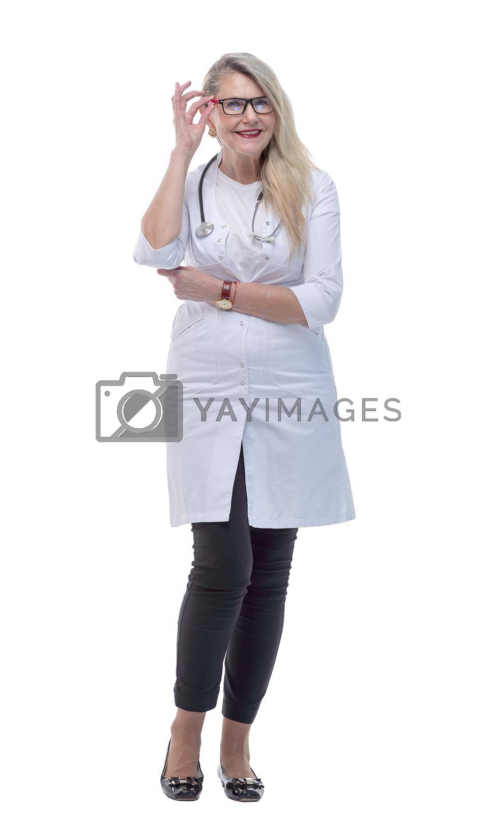 Royalty free image of in full growth. happy medic woman talking on her smartphone by asdf