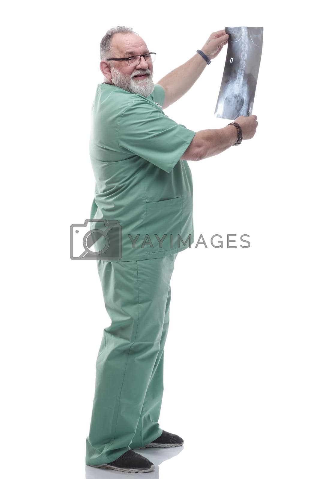 Royalty free image of in full growth. an experienced doctor looking at an x- ray of a patient by asdf