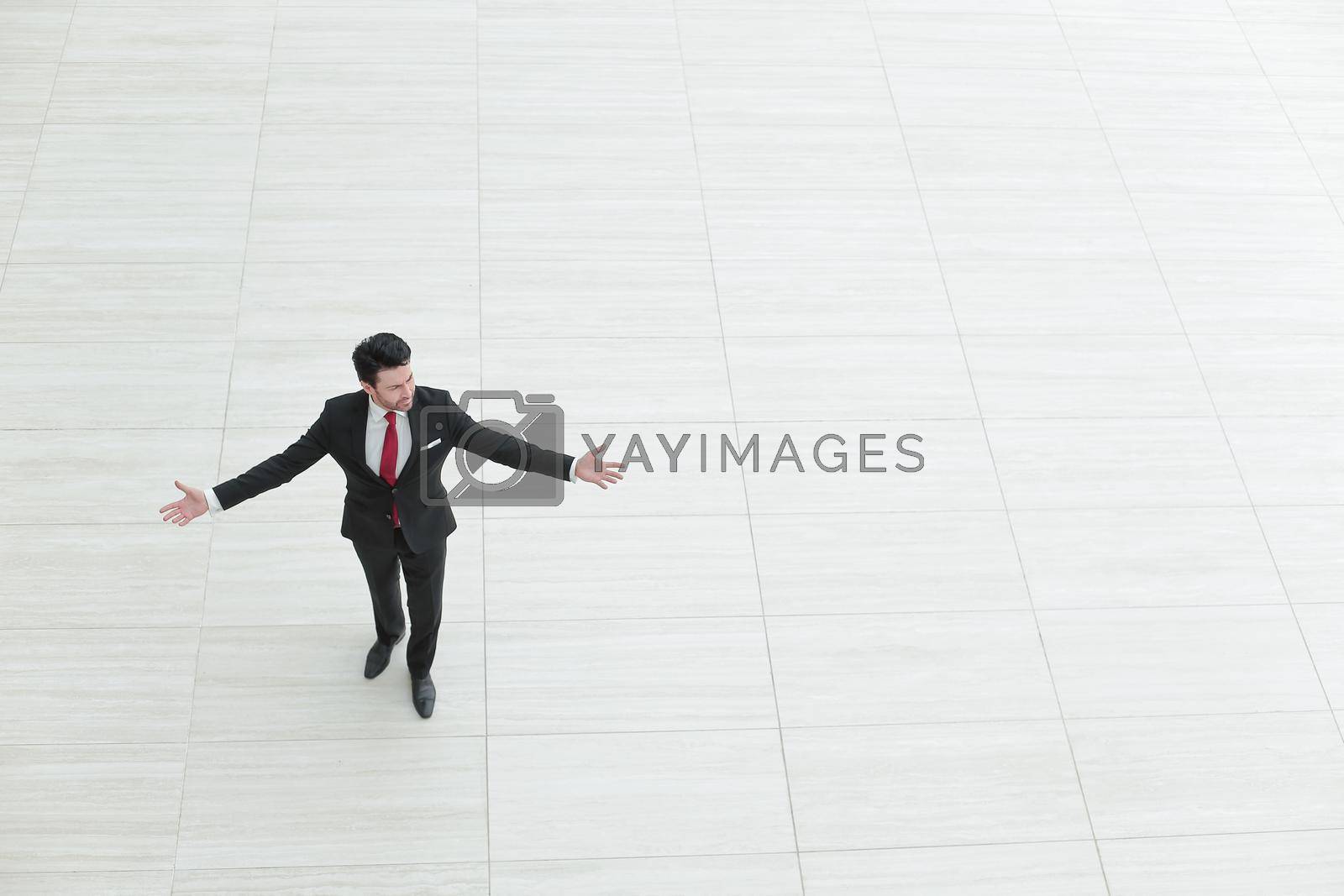 Royalty free image of top view from afar.Businessman spreads his hands to the sides by asdf