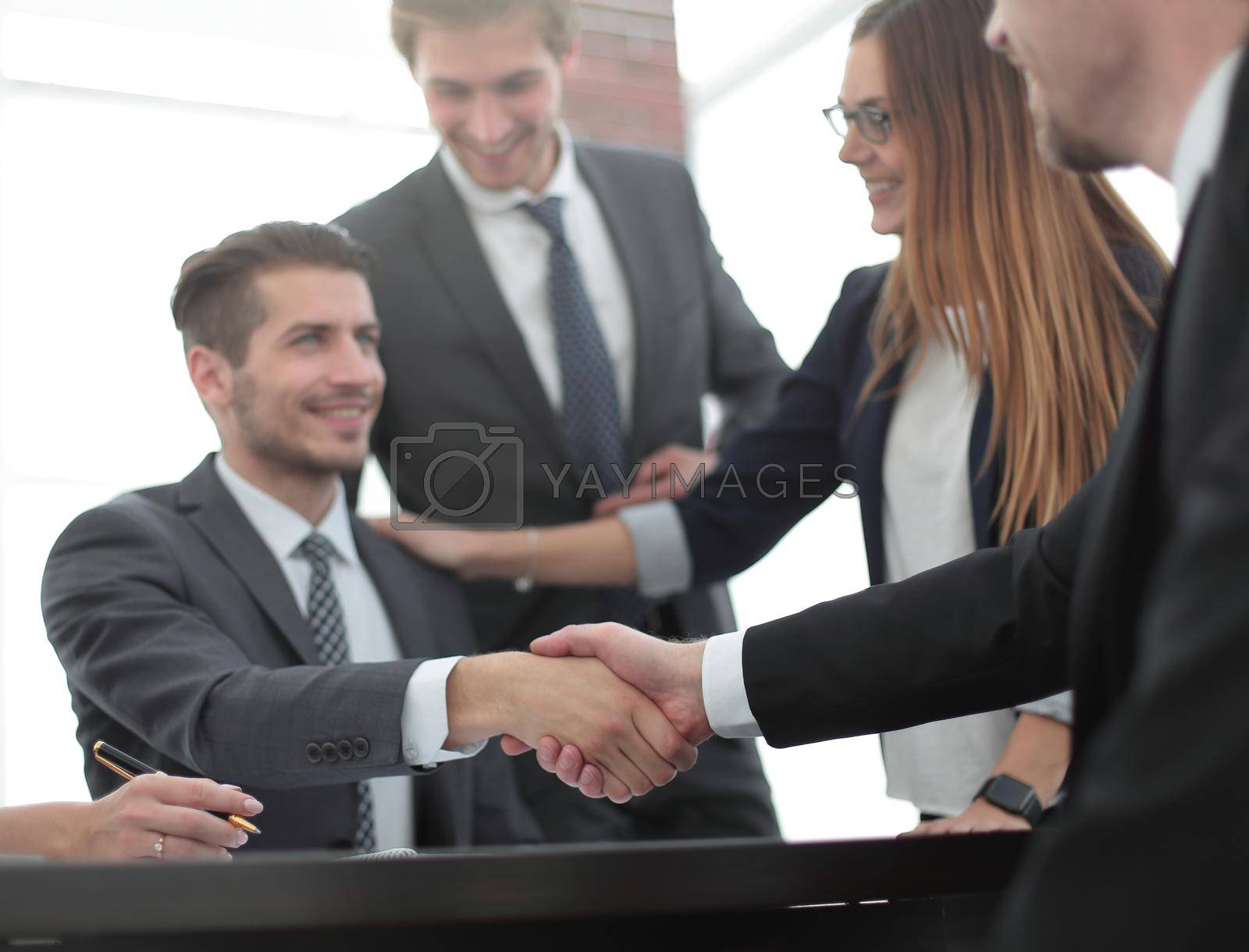 Royalty free image of Handshake between employees after the meeting by asdf
