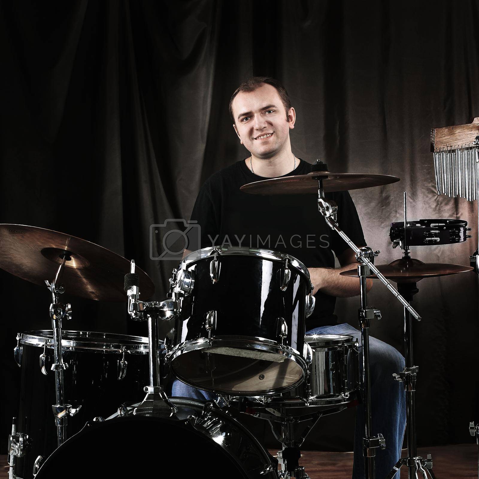 Royalty free image of musician rehearsing on the drums. youth and Hobbies by SmartPhotoLab