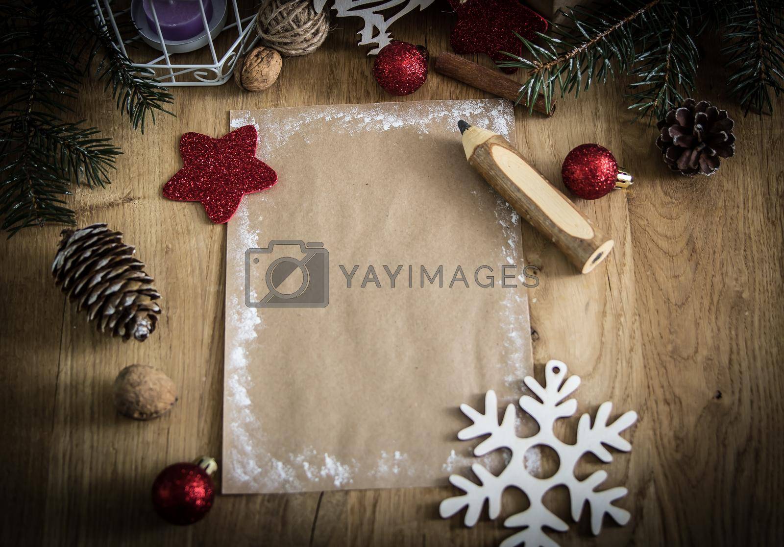 Royalty free image of greeting card and pencil in the Christmas background. by SmartPhotoLab
