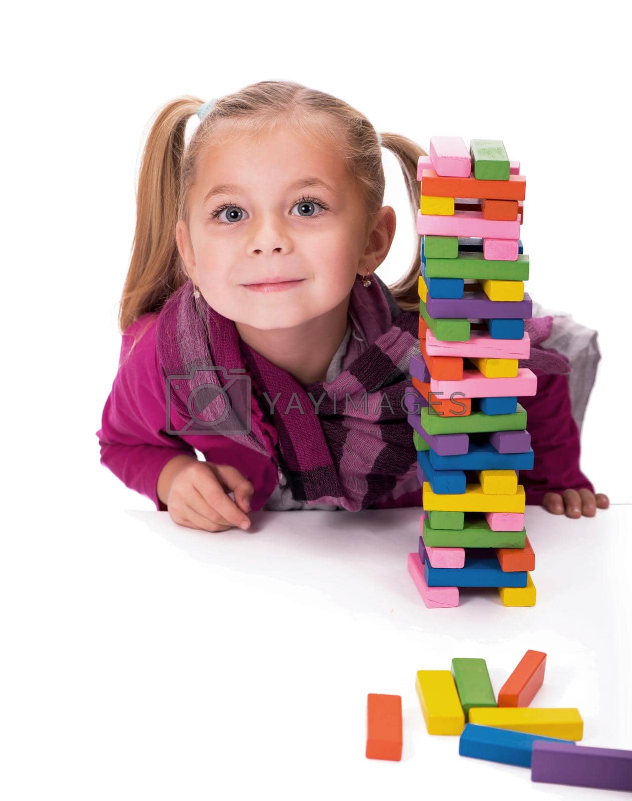 Royalty free image of girl playing with the wood game by aprilphoto