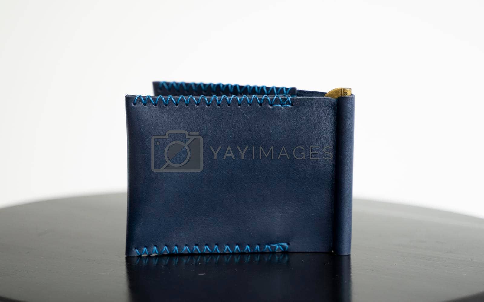Royalty free image of Blue men's money clip handmade leather wallet. Empty money clip wallet with a two pockets for cards. by vovsht