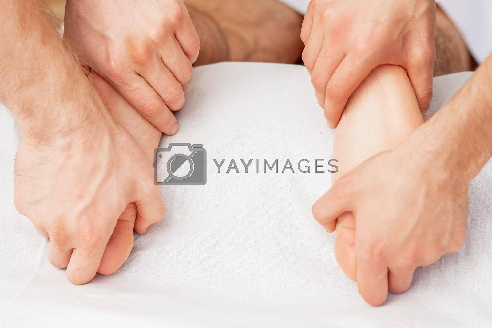 Royalty free image of Massage of soft bare feet. by okskukuruza