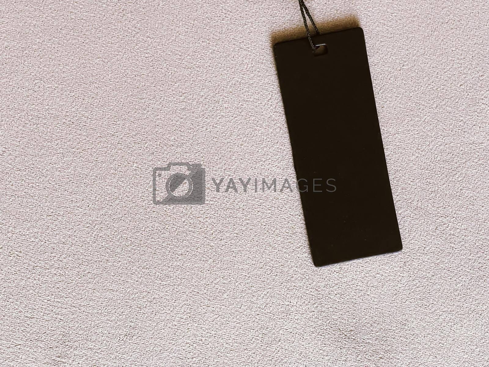 Royalty free image of Luxury black fashion label tag, sale price card on fabric background, shopping and retail by Anneleven