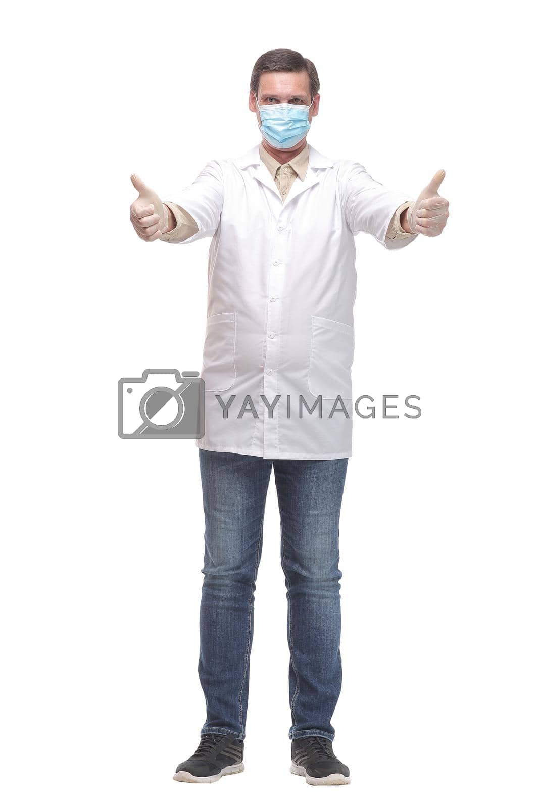 Royalty free image of Portrait of caucasian doctor using protective gloves and mask by asdf