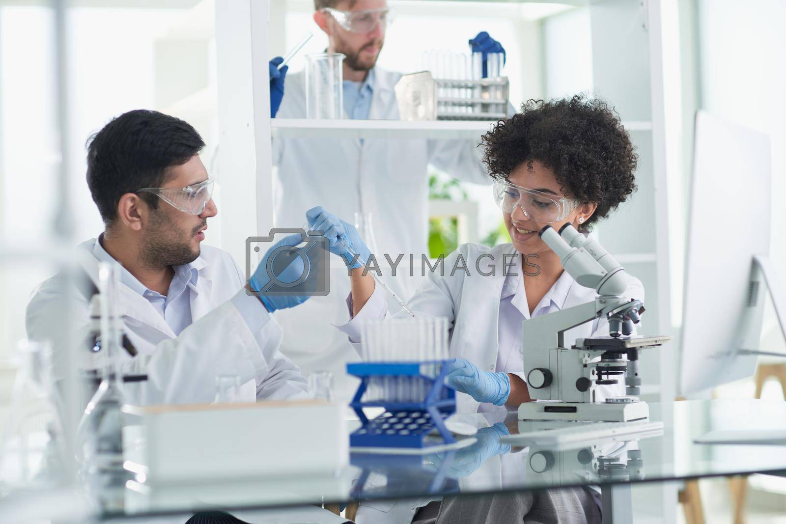 Royalty free image of Team of Medical Research Scientists Working on Generation Experimental Drug by asdf