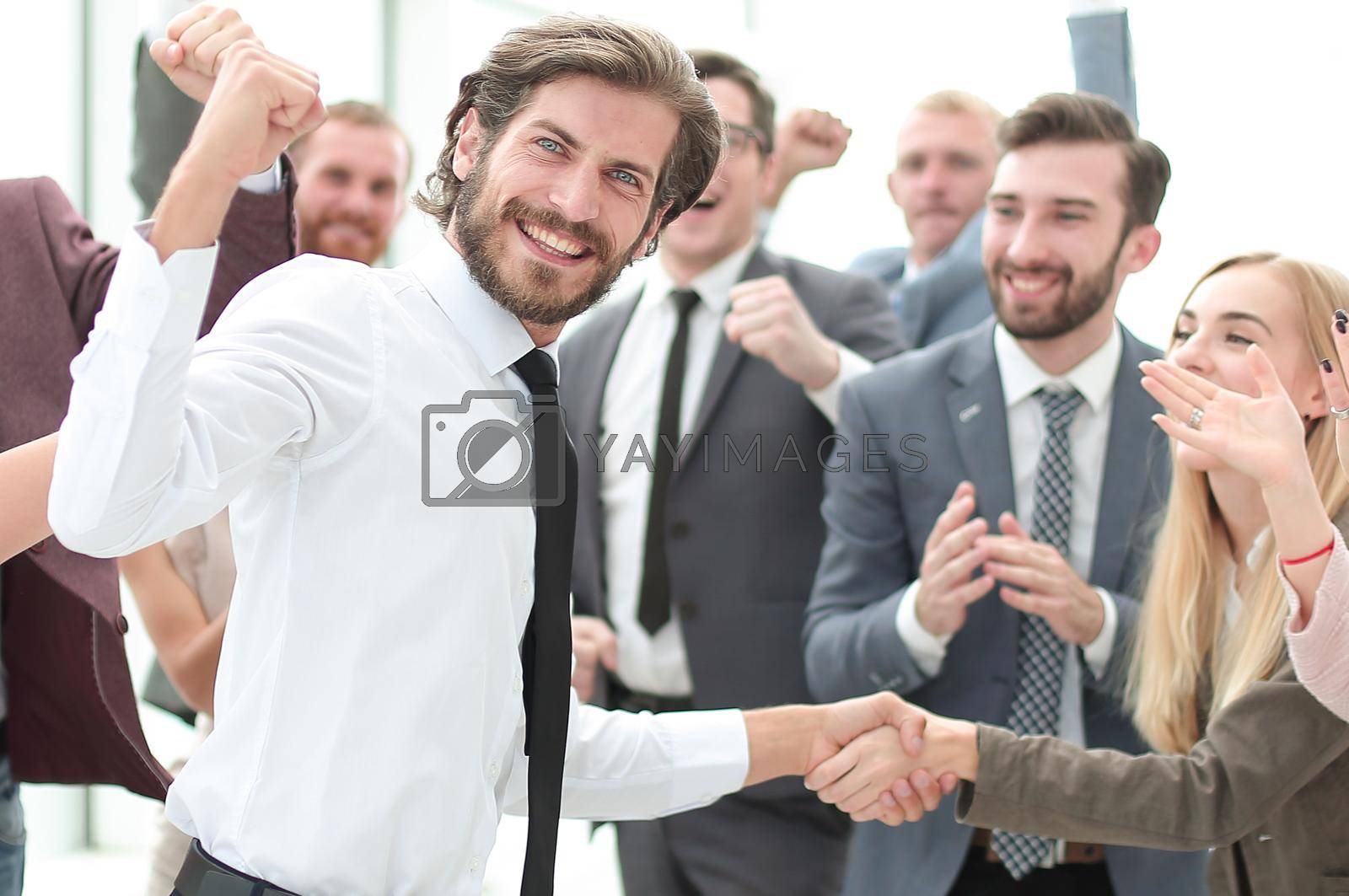 happy young businessman on business team background. photo with copy space