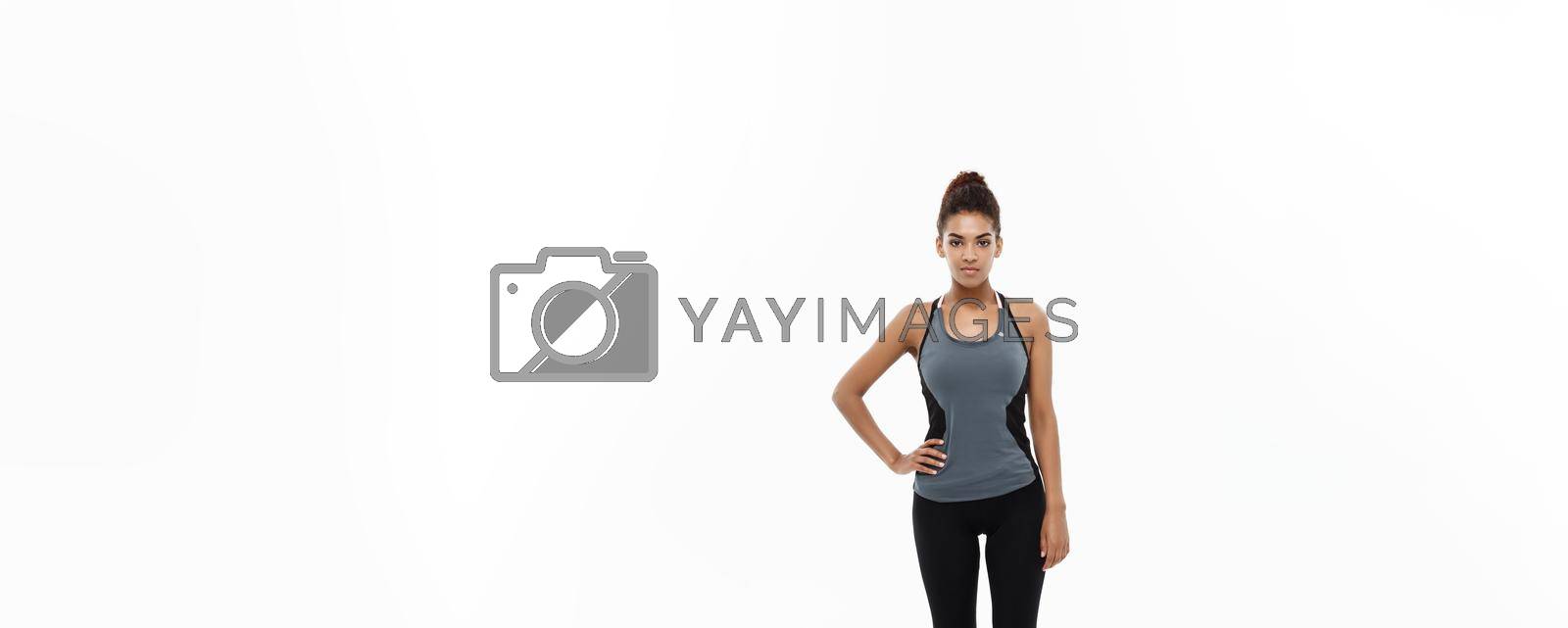 Healthy and Fitness concept - portrait of African American girl posing with fitness clothes over white studio