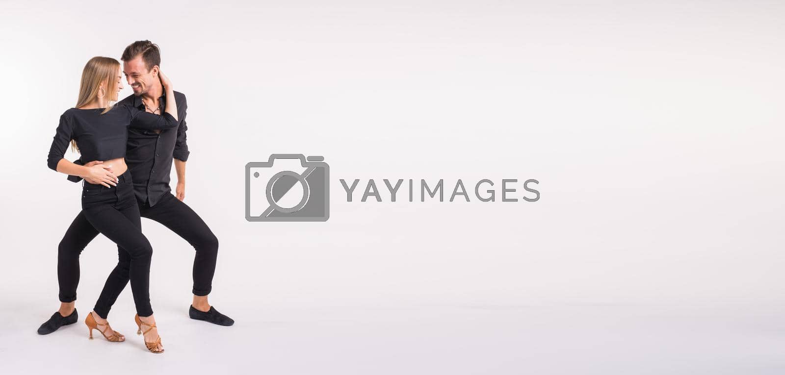 Royalty free image of Banner dancing social dance. Kizomba or bachata or semba or taraxia , on white background with copy space. Social dance concept. by Satura86