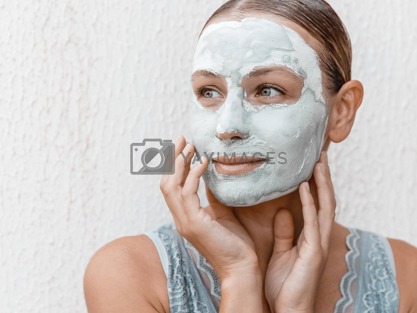 Royalty free image of Woman Applying Mud Clay by Anna_Omelchenko