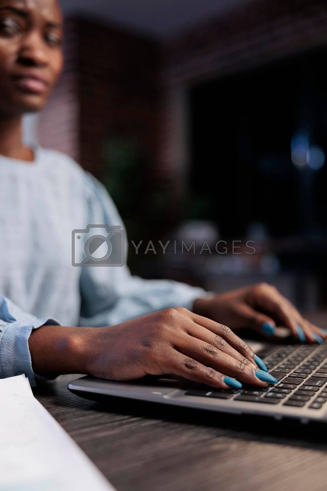 Royalty free image of Close up shot of african american forex stock professional trader at desk by DCStudio