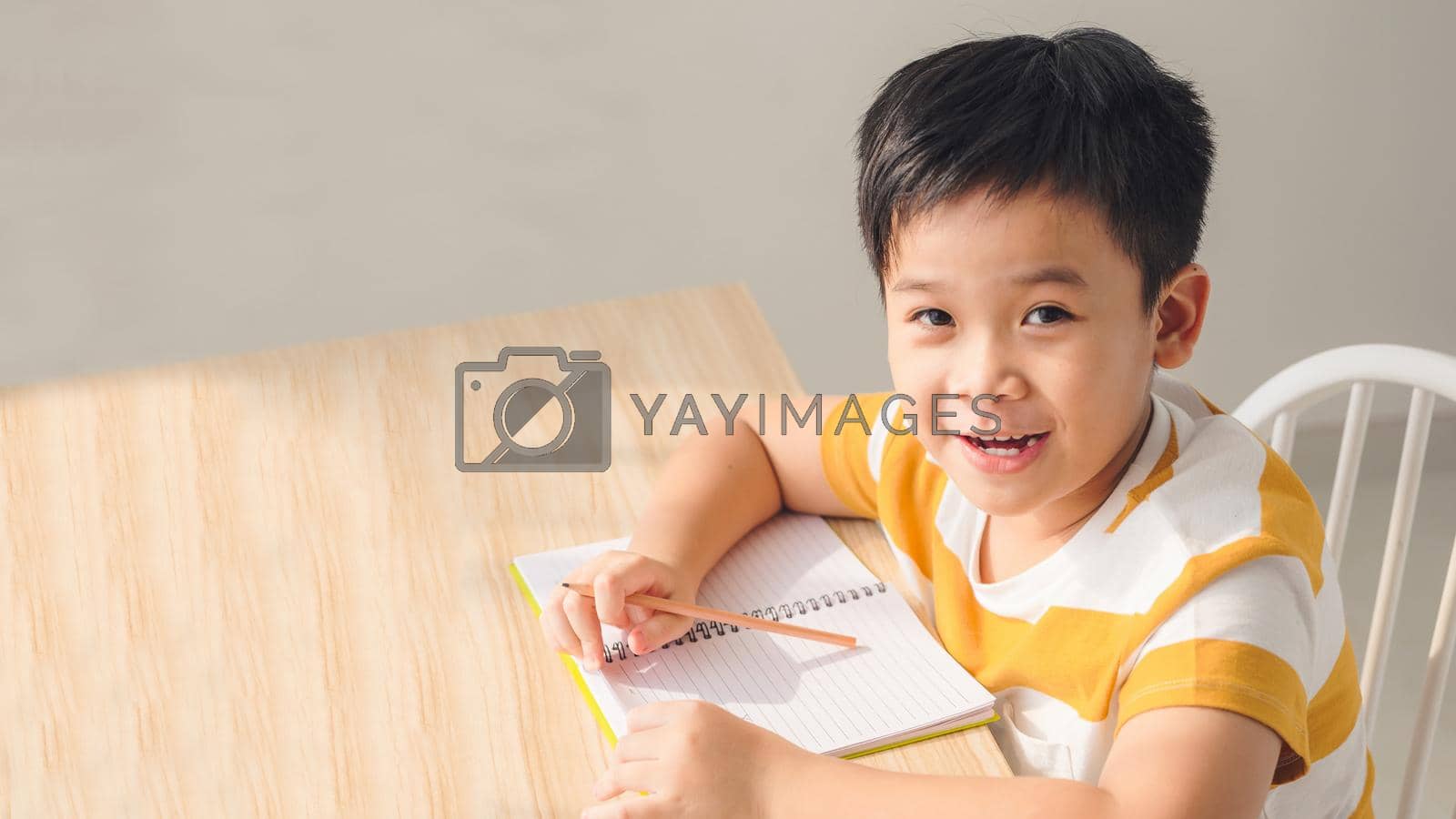 Royalty free image of Boy is studying at home by makidotvn
