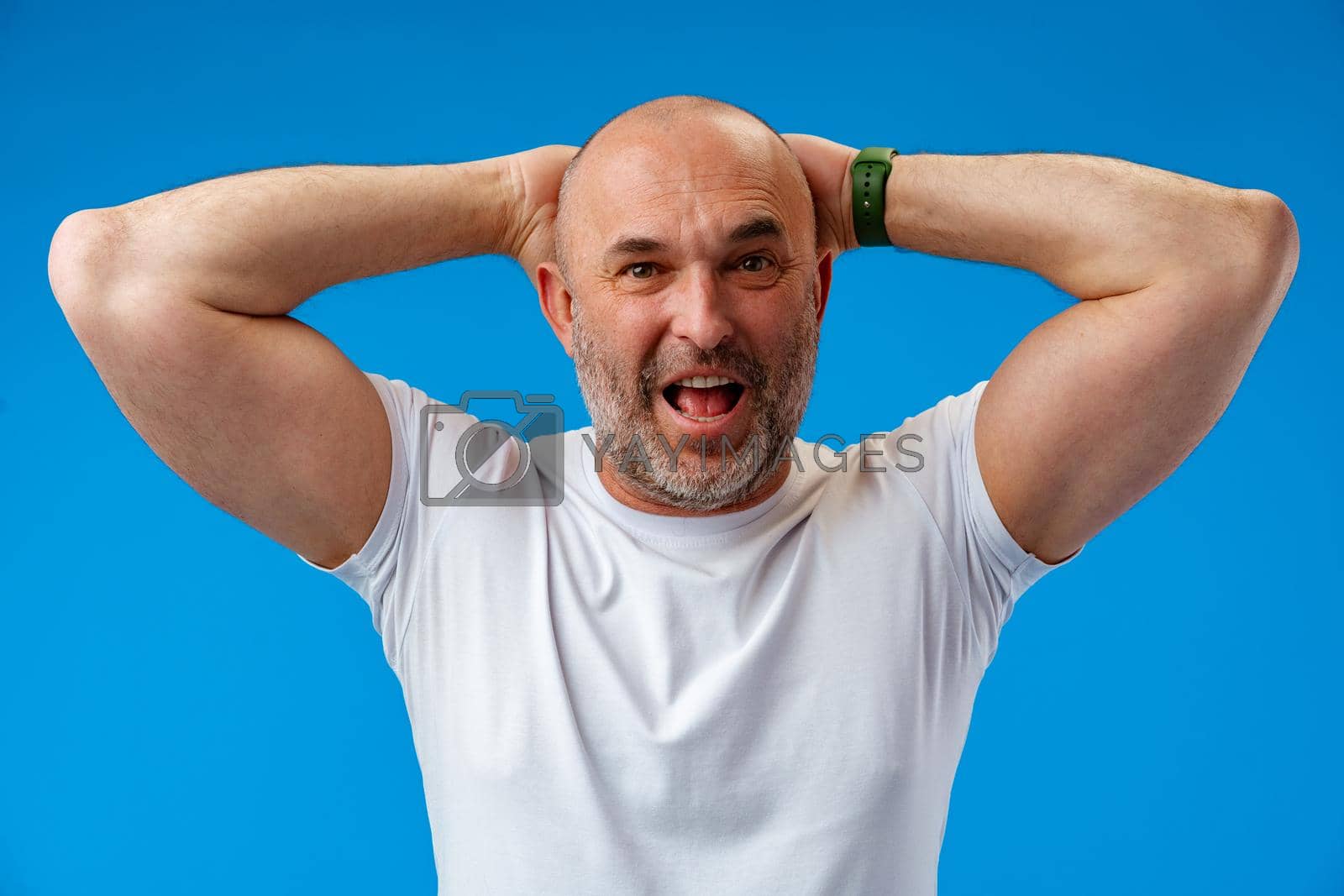 Royalty free image of Man over isolated blue background with surprise facial expression. by Fabrikasimf