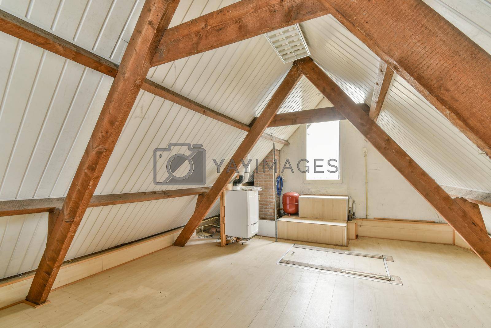Royalty free image of Spacious bright attic room for work and relaxation by casamedia