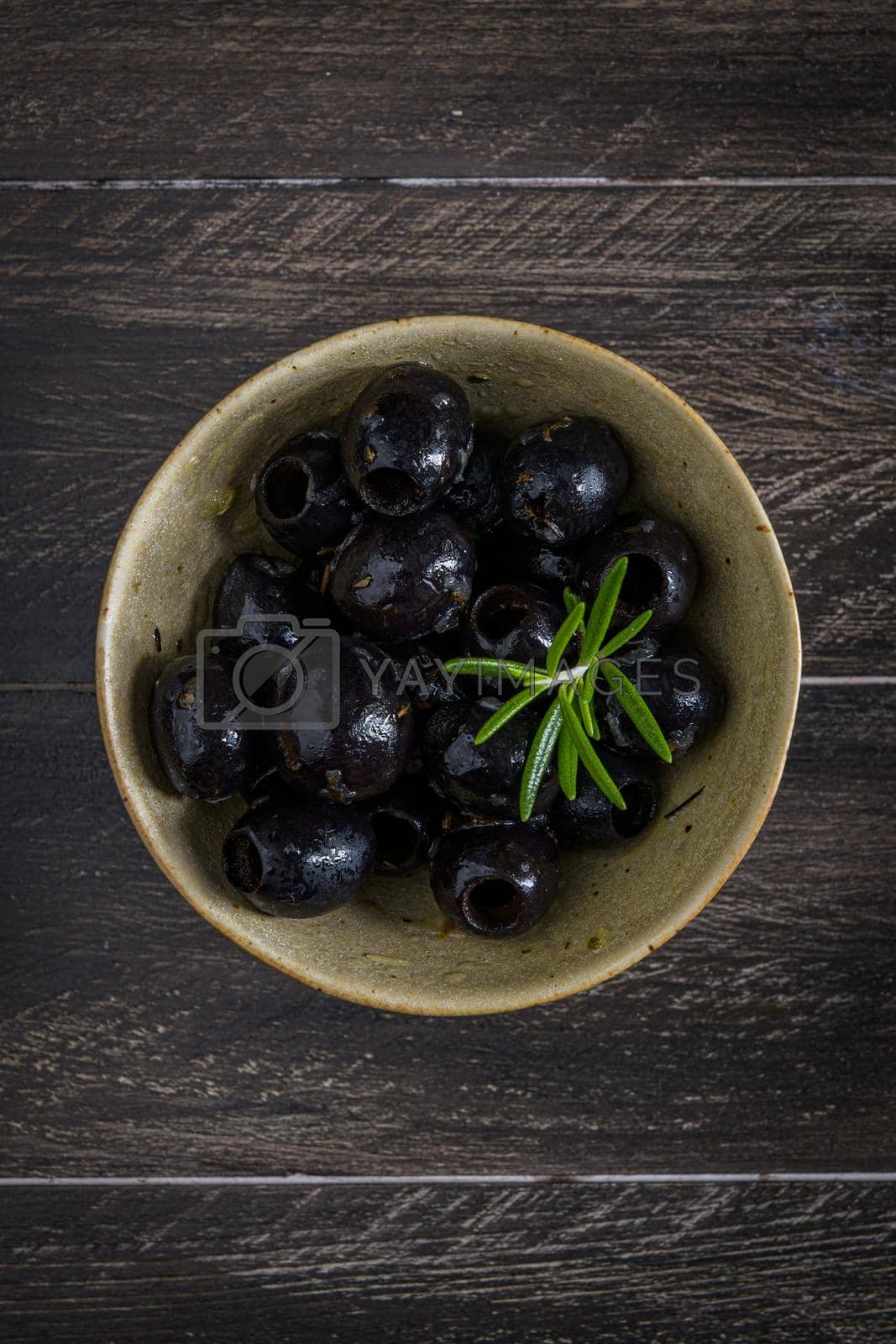 Royalty free image of Olives in a ceramic bowl  by homydesign