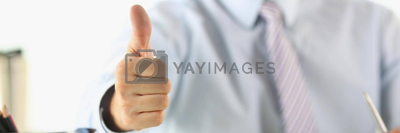 Royalty free image of Man in the office shows ok gesture, close-up by kuprevich