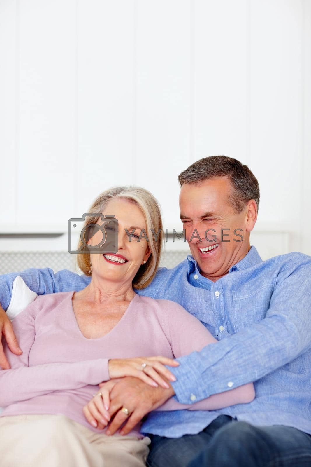 Royalty free image of Cheerful senior man with wife having fun together - copyspace. Portrait of a cheerful senior man with wife having fun together - copyspace. by YuriArcurs