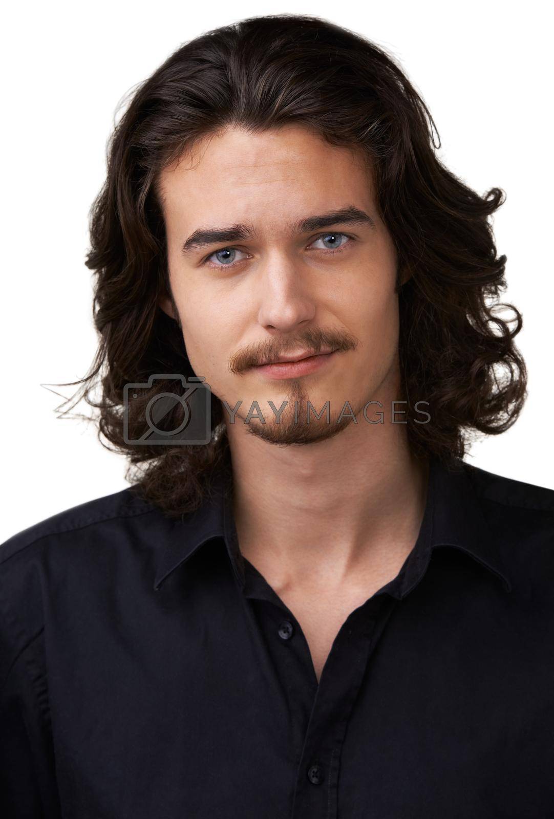 Royalty free image of Giving you that dreamy smile. Handsome young man with shoulder-length hair and a goatee smiling at the camera. by YuriArcurs