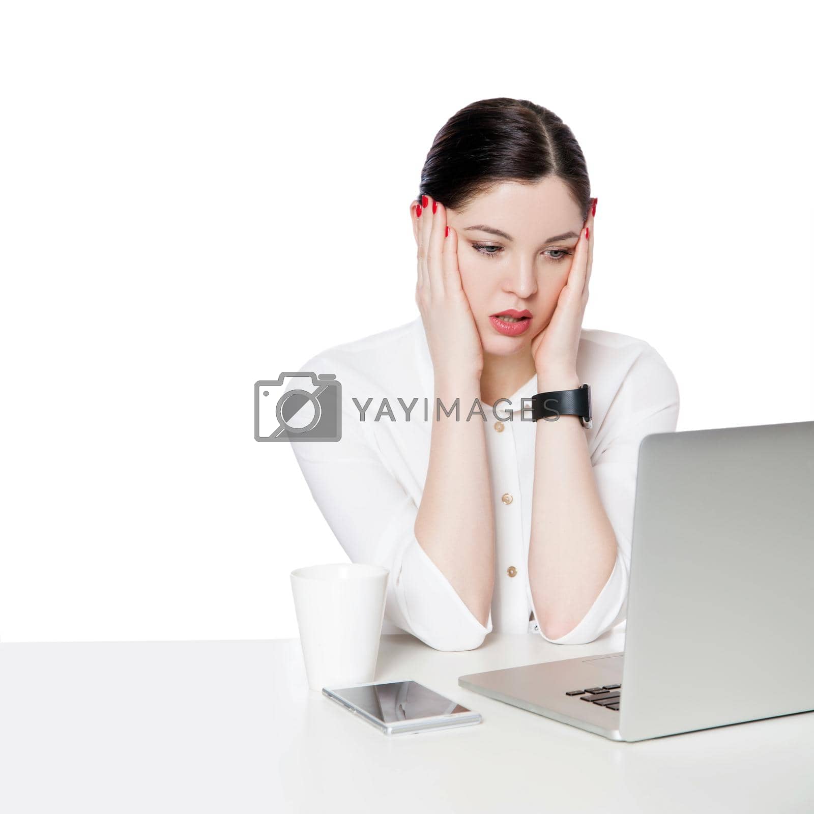 Royalty free image of Portrait of shocked attractive brunette businesswoman in white shirt sitting looking at laptop display, reading unbelievable news and confused. by Khosro1