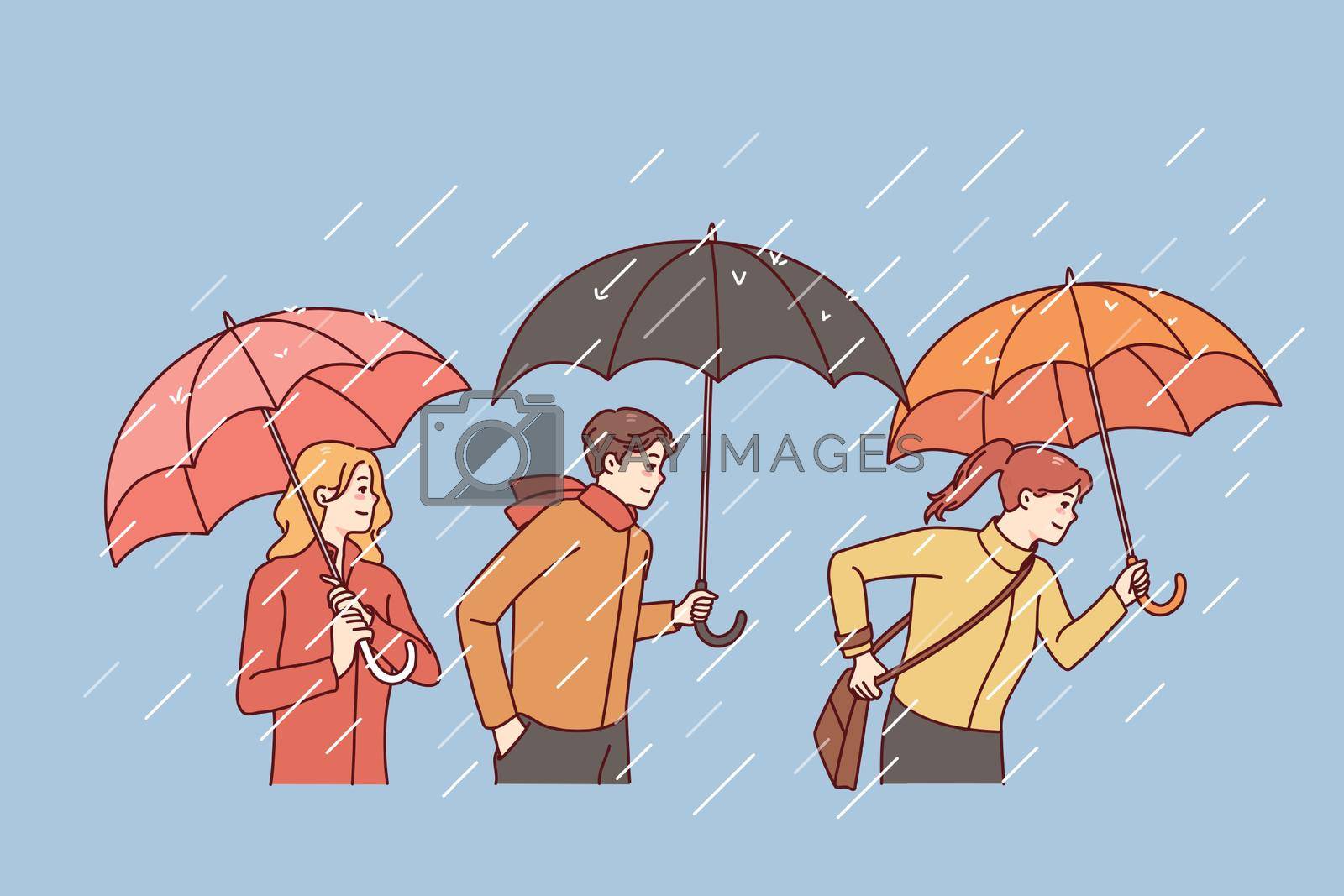 Royalty free image of People with umbrellas under rain by Vasilyeva