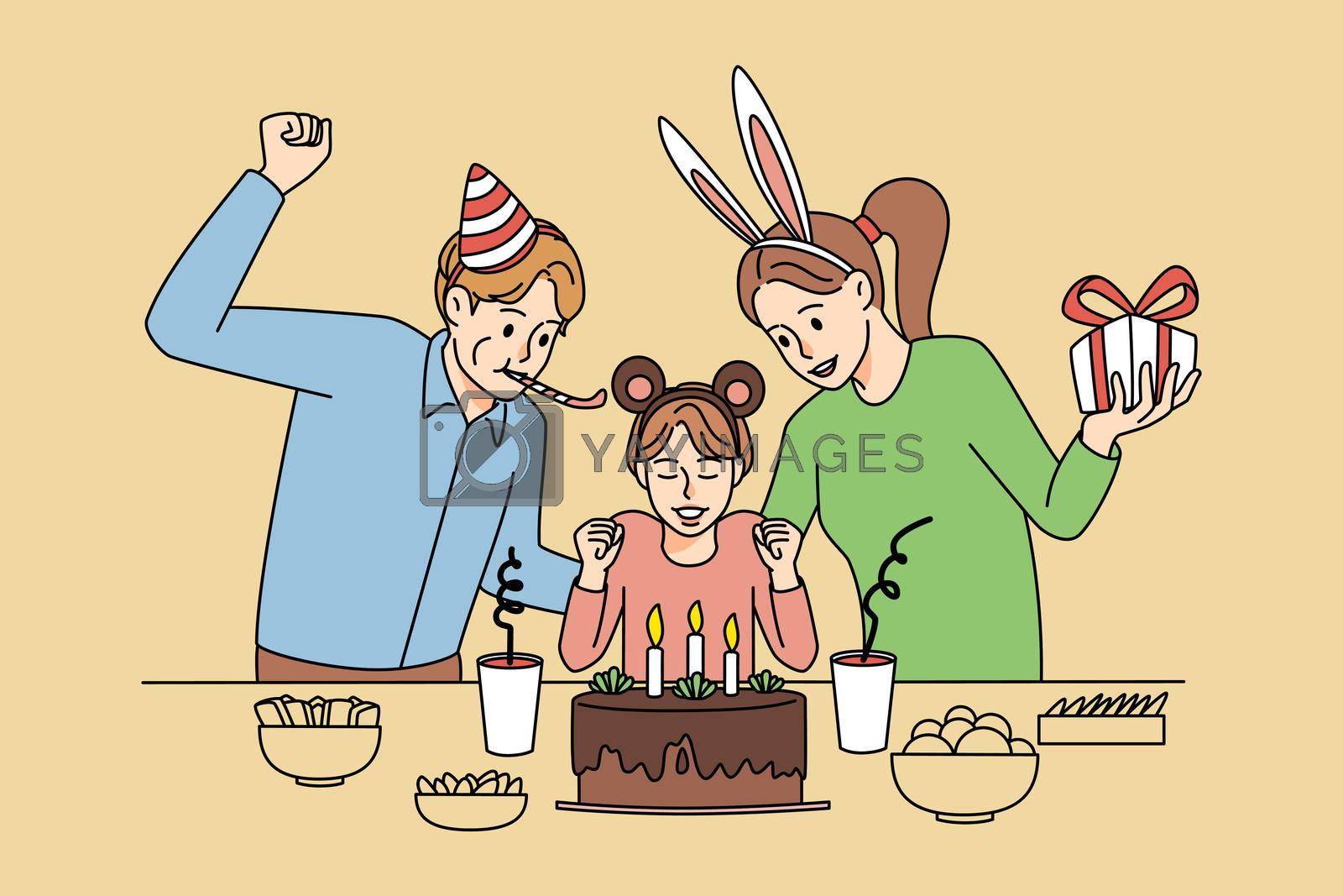 Royalty free image of Smiling parents and child celebrate birthday by Vasilyeu