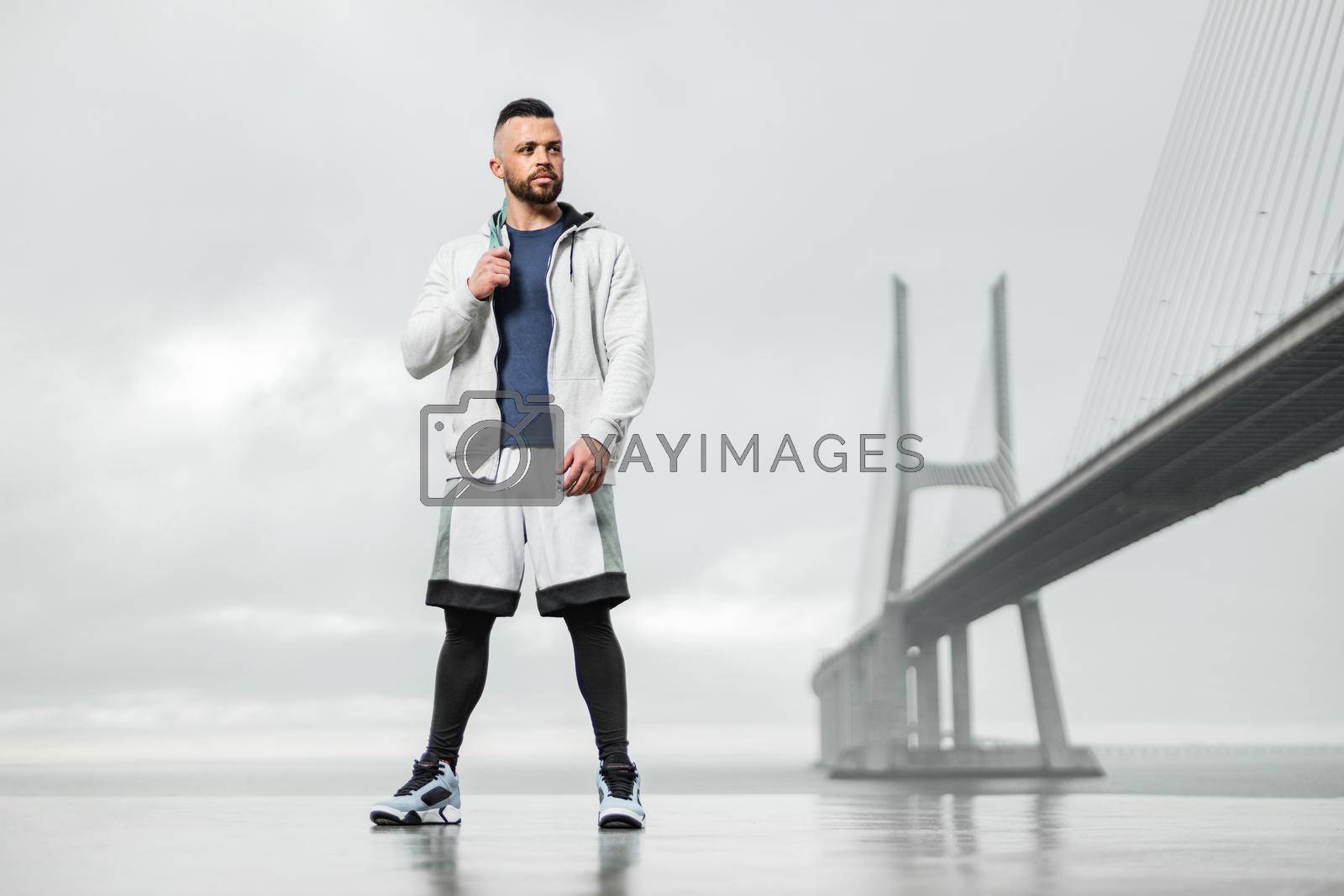 Royalty free image of Athletic man before morning run outdoors by MikeOrlov