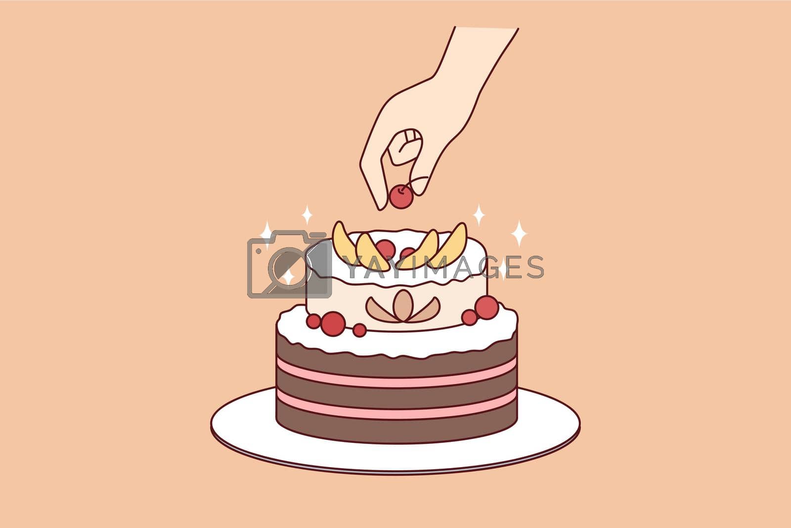Royalty free image of Person decorate cake with fruit by Vasilyeva