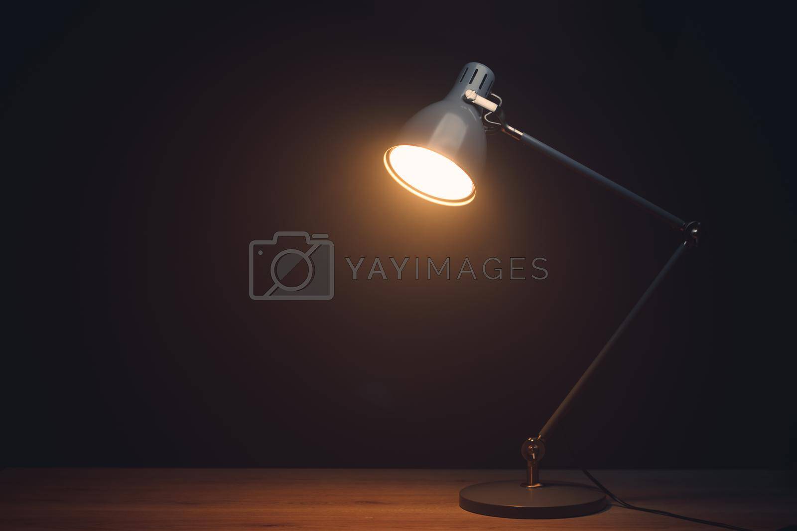 Royalty free image of desk lamp in mist, black background with copy-space by nikkytok