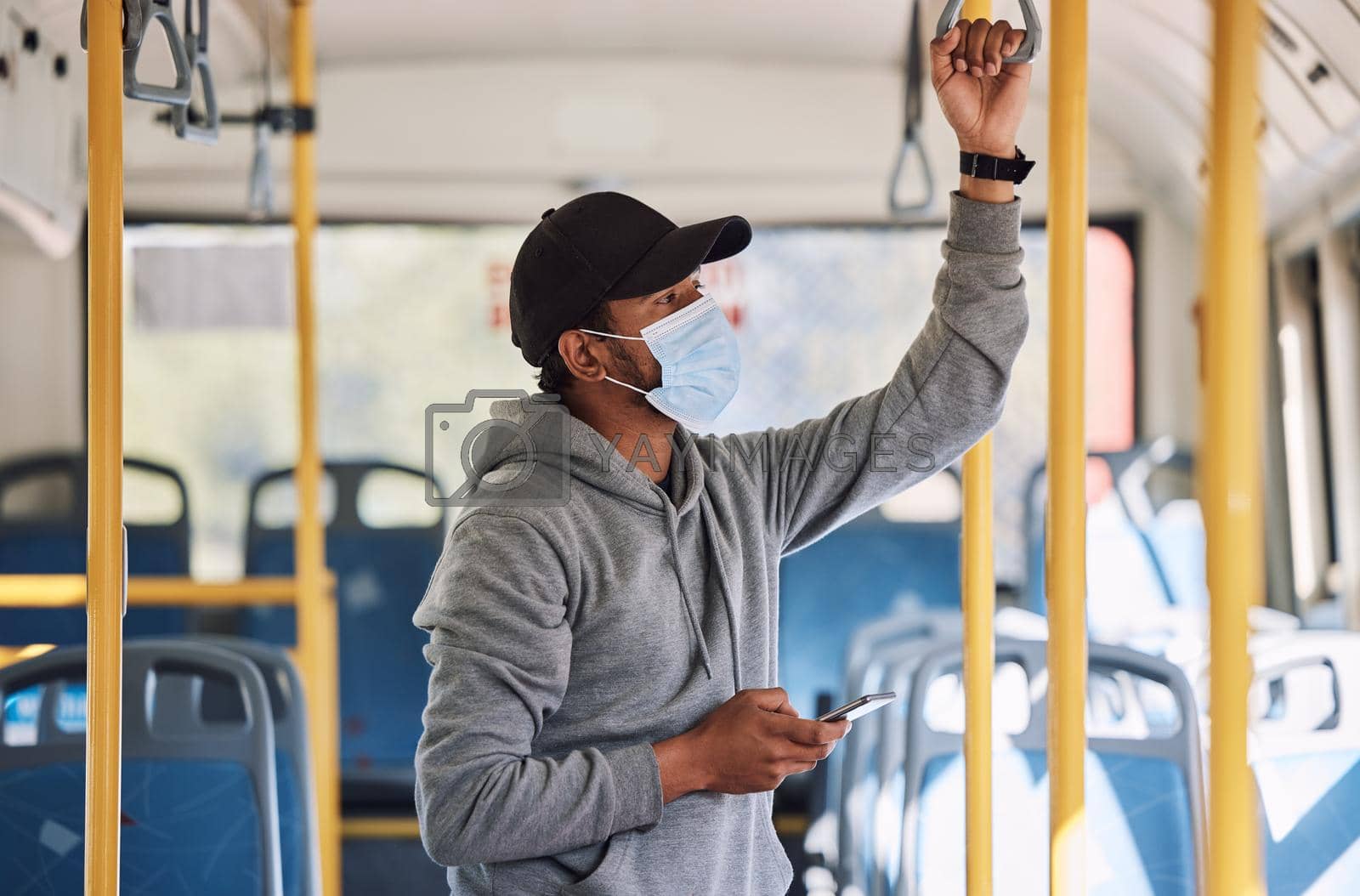 Royalty free image of Mixed race man travelling by bus in the city. Mixed race man travelling by bus in the city. by YuriArcurs